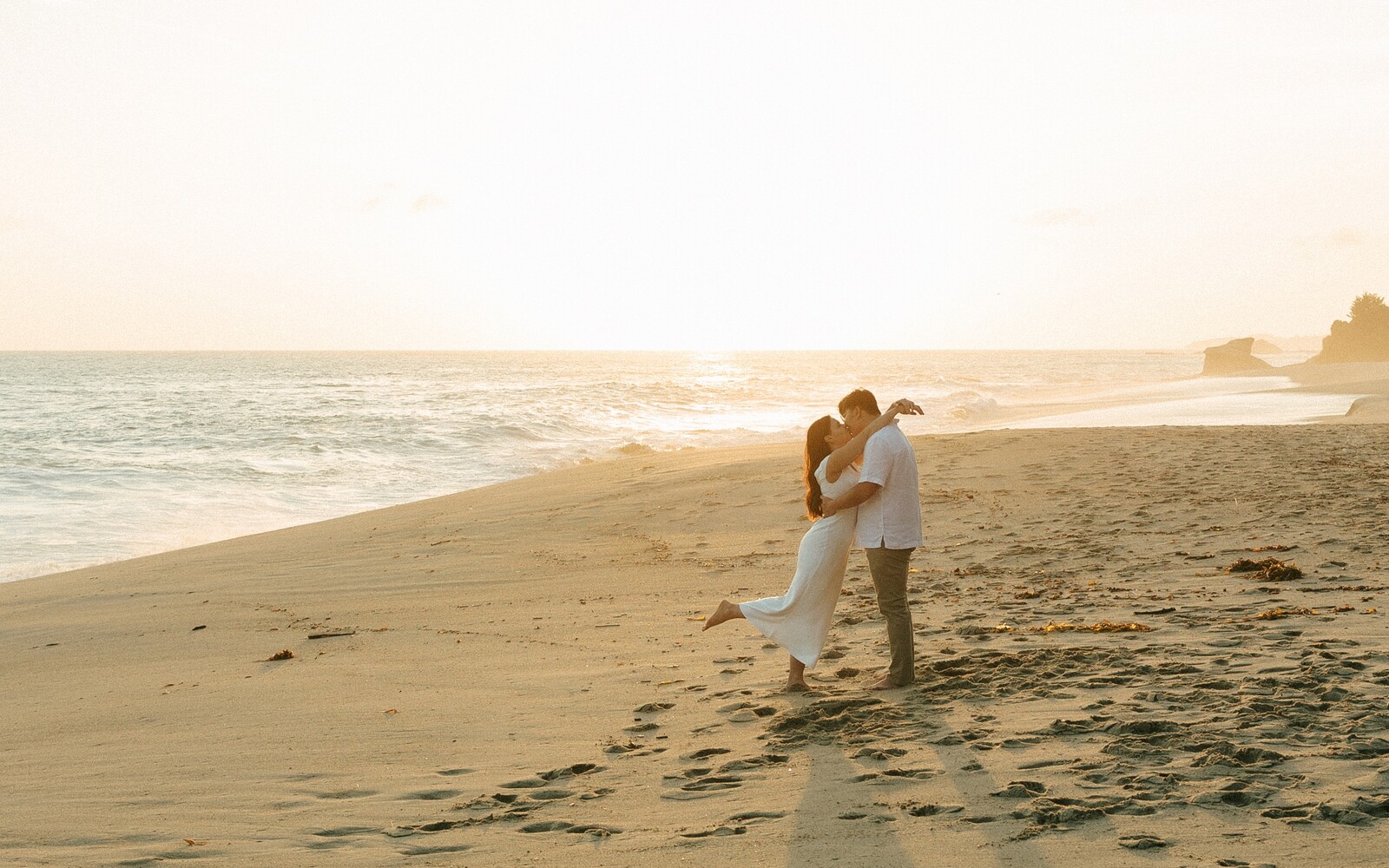 Larissa and Tony kissing at golden hour