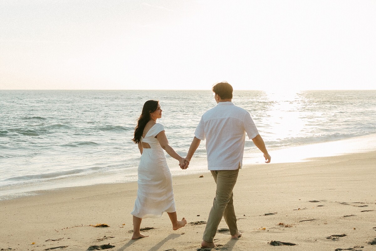Larissa and Tony walking toward the water