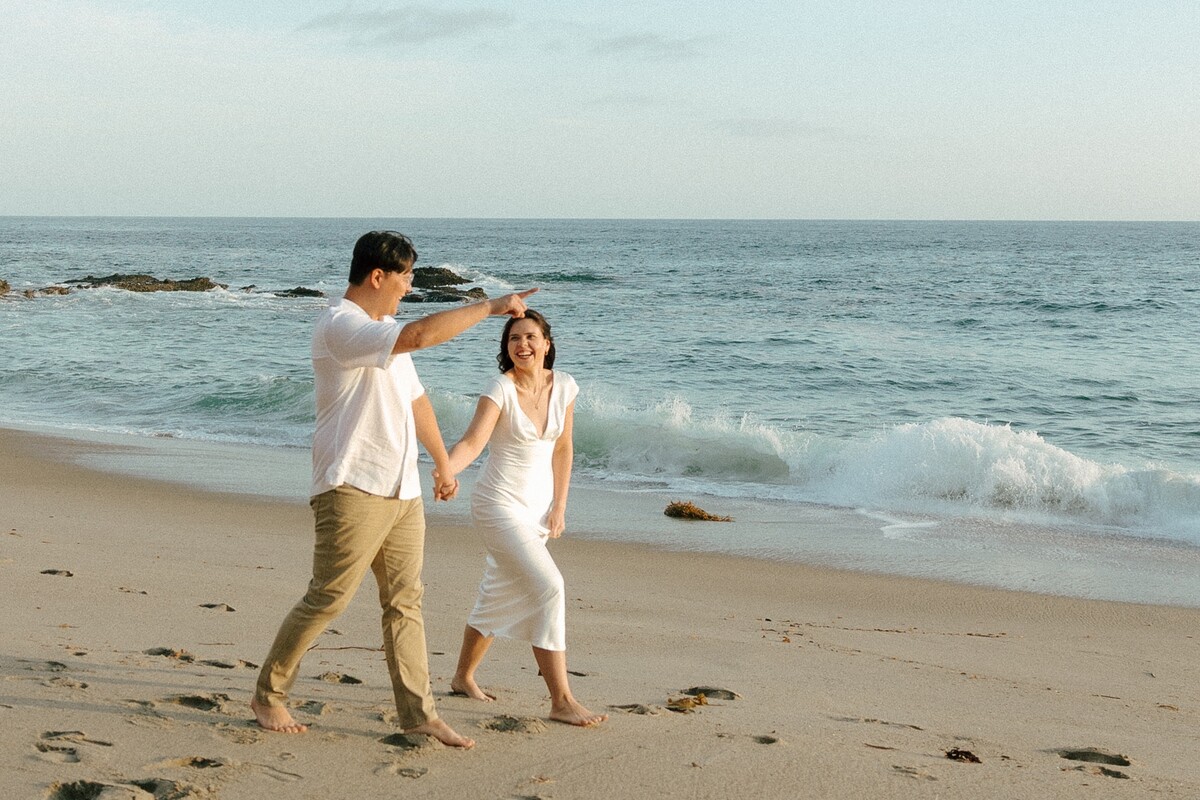 Tony and Larissa laughing on the beach